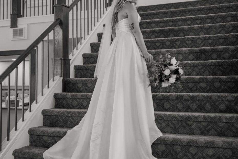 bride walking up venue stairs wedding